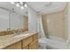 Bathroom with tub, granite vanity, and toilet at 53 W Bay Heights Rd # 205, Englewood, FL 34223
