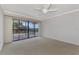 Bright bedroom with balcony access and water views at 53 W Bay Heights Rd # 205, Englewood, FL 34223