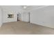 Bright living room with access to kitchen and hallway at 53 W Bay Heights Rd # 205, Englewood, FL 34223