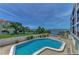 Community pool with water view at 53 W Bay Heights Rd # 205, Englewood, FL 34223