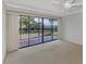 Bedroom with balcony access and water views at 53 W Bay Heights Rd # 205, Englewood, FL 34223