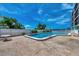 Community pool with a relaxing patio area at 53 W Bay Heights Rd # 205, Englewood, FL 34223