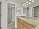 Bathroom with granite countertop and shower at 53 W Bay Heights Rd # 205, Englewood, FL 34223