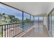 Screened balcony overlooking pool and water at 53 W Bay Heights Rd # 205, Englewood, FL 34223
