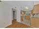 Kitchen with wood cabinets, granite countertops and view at 53 W Bay Heights Rd # 205, Englewood, FL 34223
