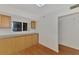 Kitchen with wood cabinets and granite countertops at 53 W Bay Heights Rd # 205, Englewood, FL 34223