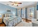 Bright bedroom with king-size bed and access to a patio at 1730 Padre Ln, Englewood, FL 34223