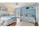 Guest bedroom with a daybed and direct access to the pool at 1730 Padre Ln, Englewood, FL 34223