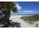 Sandy beach path to ocean with beachgoers at 1730 Padre Ln, Englewood, FL 34223