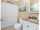 Clean bathroom with white cabinets and granite countertop at 1730 Padre Ln, Englewood, FL 34223