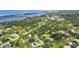 Aerial view showcasing the neighborhood's proximity to the water and lush surroundings at 1730 Padre Ln, Englewood, FL 34223
