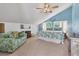 Bedroom with king-size bed and tropical decor at 1730 Padre Ln, Englewood, FL 34223