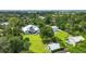 Aerial view showing house, detached studio, and waterfront lot at 1730 Padre Ln, Englewood, FL 34223