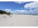 Expansive beach view with lifeguard station at 1730 Padre Ln, Englewood, FL 34223