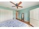 Bright bedroom with double doors and ceiling fan at 14143 Saul Ln, Port Charlotte, FL 33981