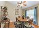 Dining room with hardwood floors, round wooden table, and four chairs at 14143 Saul Ln, Port Charlotte, FL 33981