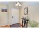 Home entryway with a console table, mirror, and hardwood floors at 14143 Saul Ln, Port Charlotte, FL 33981