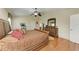 Main bedroom with hardwood floors and ensuite bathroom at 14143 Saul Ln, Port Charlotte, FL 33981