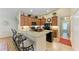 Granite kitchen island with seating for three at 14143 Saul Ln, Port Charlotte, FL 33981