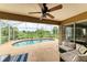 Relaxing screened pool area with patio furniture at 14143 Saul Ln, Port Charlotte, FL 33981