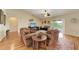 Bright and airy living room with hardwood floors and access to the pool area at 14143 Saul Ln, Port Charlotte, FL 33981