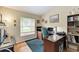 Bright home office features built-in shelving and large window at 14143 Saul Ln, Port Charlotte, FL 33981