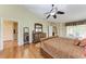 Main bedroom with hardwood floors and ensuite bathroom at 14143 Saul Ln, Port Charlotte, FL 33981