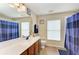 Clean bathroom with updated vanity and shower at 14143 Saul Ln, Port Charlotte, FL 33981