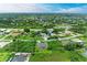 Aerial view of a house and neighborhood at 14143 Saul Ln, Port Charlotte, FL 33981