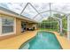 Relaxing pool area with screened enclosure at 14143 Saul Ln, Port Charlotte, FL 33981