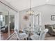 Charming dining area featuring a glass-top table and four chairs at 10168 Willowood Ave, Englewood, FL 34224
