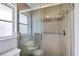 Updated walk-in shower with tiled walls and seat at 10168 Willowood Ave, Englewood, FL 34224