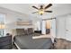 King-size bed, dresser, and sliding barn doors in bedroom at 10168 Willowood Ave, Englewood, FL 34224