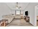 Spacious living room with two beige sofas and a flat-screen TV at 10168 Willowood Ave, Englewood, FL 34224