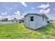 Metal storage shed in backyard of property at 10168 Willowood Ave, Englewood, FL 34224
