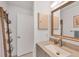 Bathroom features vanity with sink and storage at 10168 Willowood Ave, Englewood, FL 34224