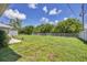 Expansive grassy backyard with a shed and fence at 10168 Willowood Ave, Englewood, FL 34224