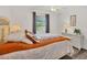 Cozy bedroom with a queen-size bed and ceiling fan at 10168 Willowood Ave, Englewood, FL 34224