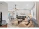 Open living and dining area with hardwood floors and neutral decor at 10168 Willowood Ave, Englewood, FL 34224