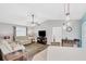 Relaxing living room with two reclining sofas and ceiling fan at 10168 Willowood Ave, Englewood, FL 34224