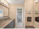 Modern bathroom with double vanity and walk-in shower at 10168 Willowood Ave, Englewood, FL 34224
