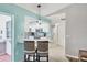 Kitchen with light cabinets, a breakfast bar, and pendant lighting at 10168 Willowood Ave, Englewood, FL 34224