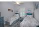 Guest bedroom with twin beds and coastal-themed bedding at 10136 Amy Ter, Port Charlotte, FL 33981