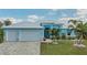 Stunning light blue home with a metal roof and spacious driveway at 10136 Amy Ter, Port Charlotte, FL 33981
