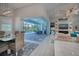 Open concept dining room with pool view and modern light fixture at 10136 Amy Ter, Port Charlotte, FL 33981