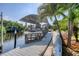 Private dock with a covered boat slip at 200 Capstan Dr, Placida, FL 33946
