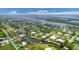 Aerial view of waterfront homes and lush landscaping at 200 Capstan Dr, Placida, FL 33946