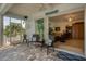 Relaxing screened lanai with tiled flooring and access to backyard at 200 Capstan Dr, Placida, FL 33946
