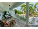 Cozy front porch with wicker furniture and tropical views at 200 Capstan Dr, Placida, FL 33946