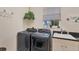 Convenient laundry room with washer, dryer, and utility sink at 200 Capstan Dr, Placida, FL 33946